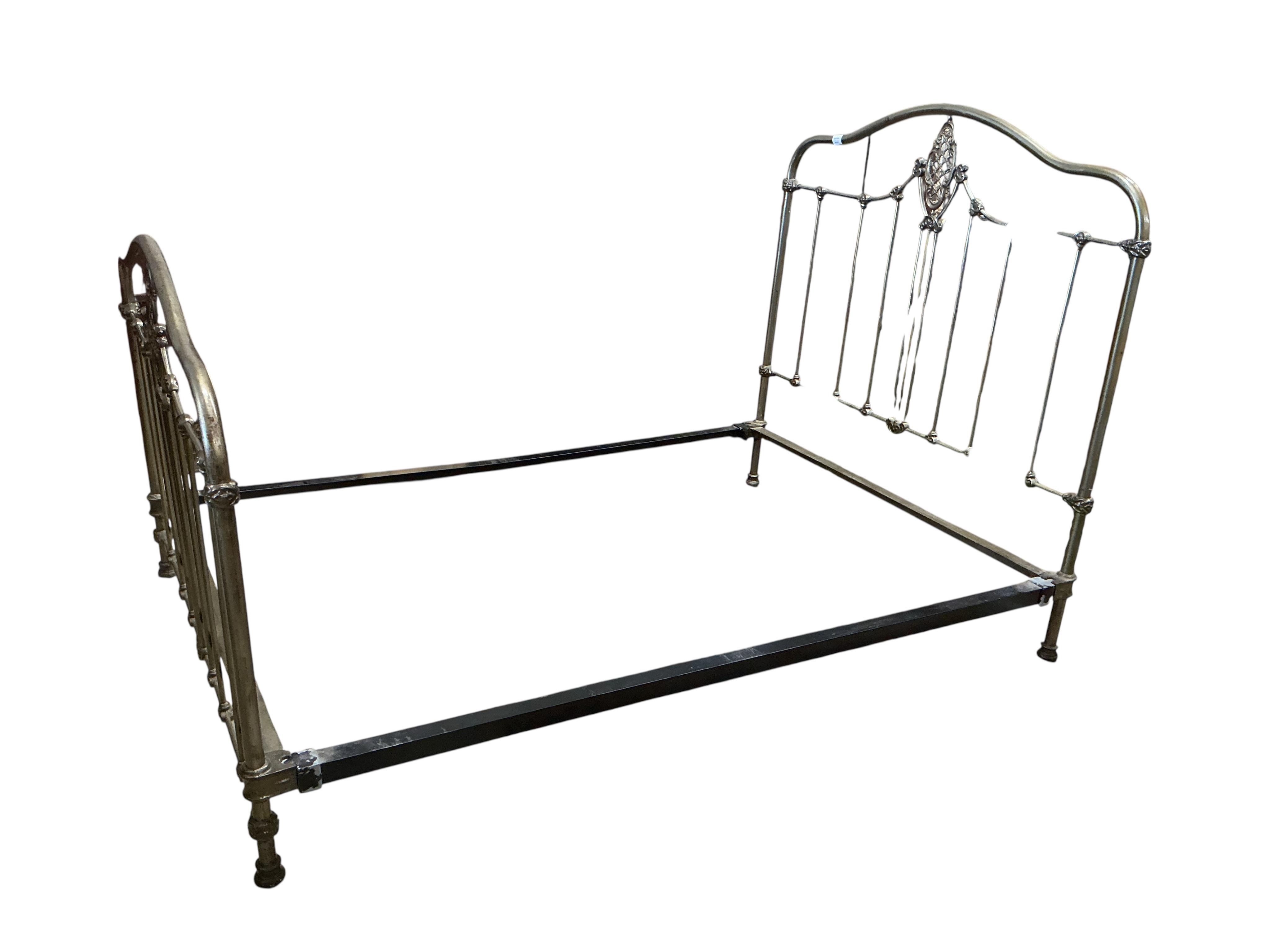 A Victorian style metal bedframe, width 138cm, length 202cm, height 136cm